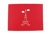 Front cover of card with red color features Eifel Towel and clouds
