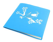 Front cover of card with blue color features bird on a branch