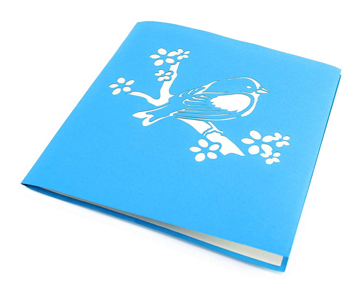 Front cover of card with blue color features bird on a branch